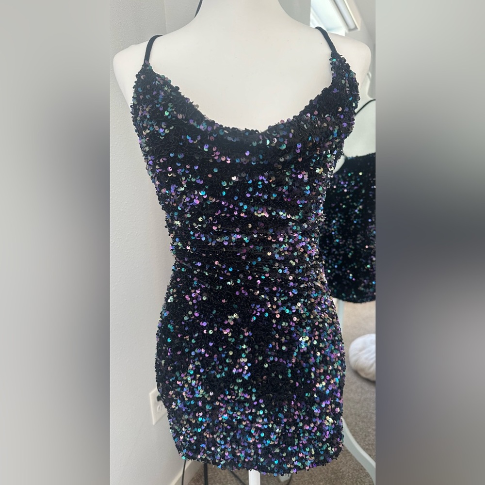 Black and blue sequins mini dress! Super flattering with a scoop neck. Size XS